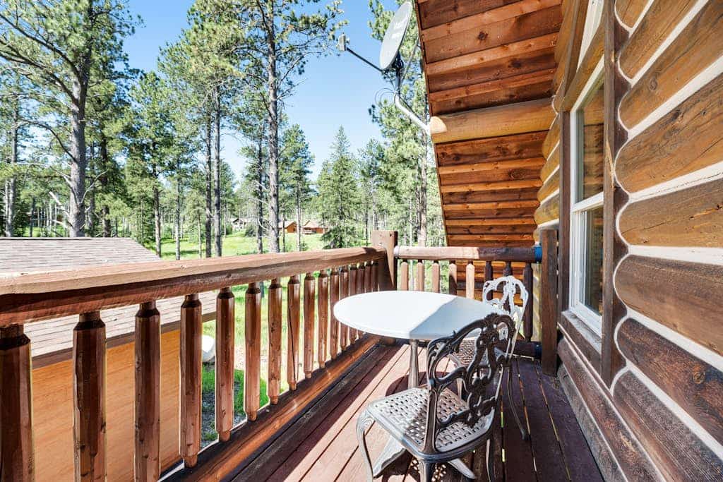Escape to Boulder Ridge Lodge, a stunning 5-bedroom log cabin located in the heart of the Black Hills near Lead. This spacious retreat offers the perfect blend of luxury and comfort, featuring a private hot tub, soaring vaulted ceilings, and custom rock fireplaces. Designed for groups and families, the lodge includes a fully equipped kitchen and pet-friendly accommodations. Whether you are hitting the links at the adjacent Lead Country Club, exploring the Mickelson Trail, or skiing at Terry Peak, our lodge serves as the ultimate year-round basecamp for your South Dakota adventure.