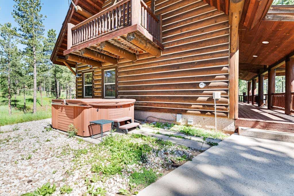 Escape to Boulder Ridge Lodge, a stunning 5-bedroom log cabin located in the heart of the Black Hills near Lead. This spacious retreat offers the perfect blend of luxury and comfort, featuring a private hot tub, soaring vaulted ceilings, and custom rock fireplaces. Designed for groups and families, the lodge includes a fully equipped kitchen and pet-friendly accommodations. Whether you are hitting the links at the adjacent Lead Country Club, exploring the Mickelson Trail, or skiing at Terry Peak, our lodge serves as the ultimate year-round basecamp for your South Dakota adventure.
