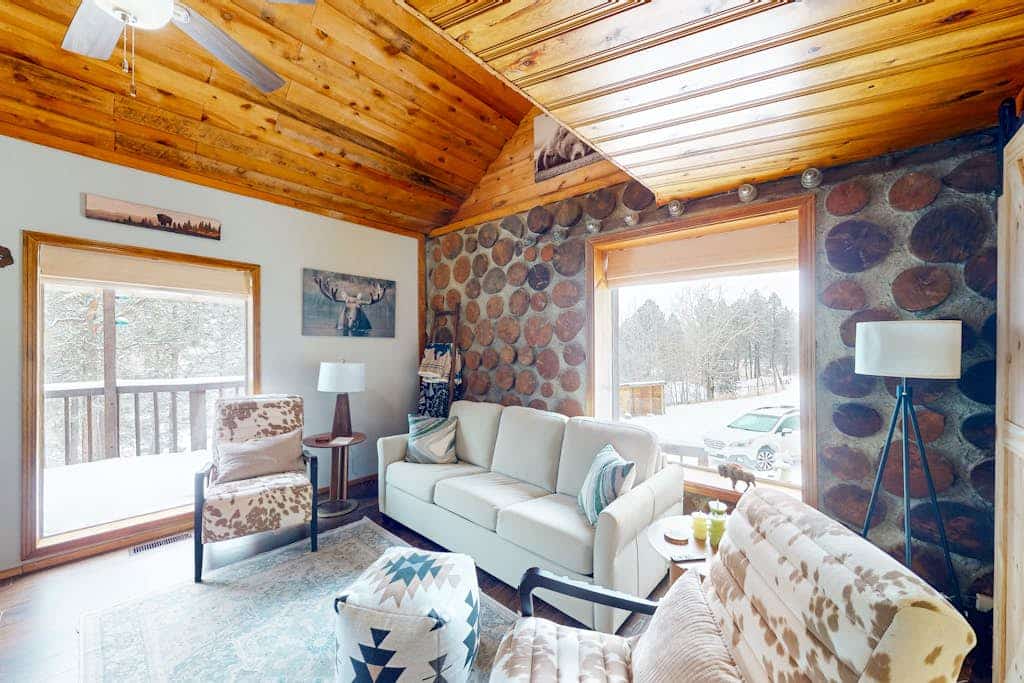 Experience a unique escape at this custom built 2 bedroom cabin near Custer. Crafted with a one of a kind stacked cordwood design, this retreat blends rustic charm with modern comfort. Enjoy high vaulted ceilings, a cozy wood stove, and a spacious deck perfect for watching Black Hills sunsets. Located minutes from Mount Rushmore, Custer State Park, and Crazy Horse, our haven is the ideal base for couples and families looking to explore South Dakota while enjoying a serene and character filled getaway.