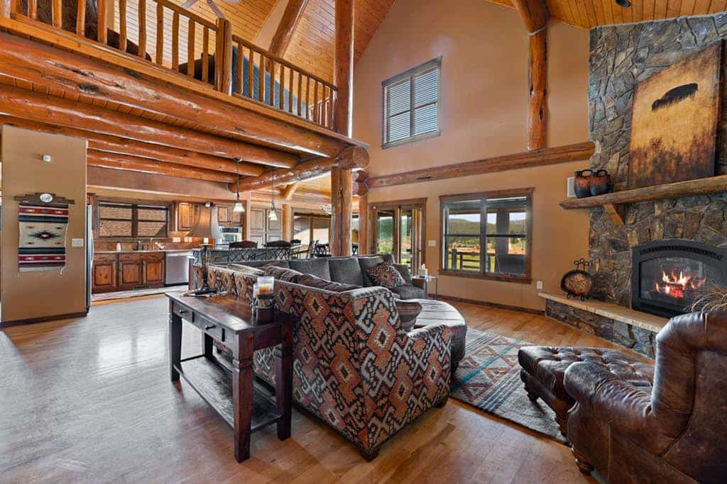 Experience the ultimate Black Hills getaway at Reunion Lodge, a stunning three bedroom cabin in Sturgis. Perched in the picturesque hills, this retreat offers breathtaking mountain views and premium amenities, including a private hot tub, a spacious game room, and a chef kitchen. Whether you are relaxing by the cozy fireplace or exploring nearby Mount Rushmore and Deadwood, our lodge is the perfect basecamp for your group reunion. Enjoy luxury, comfort, and easy access to top regional attractions in this serene setting.