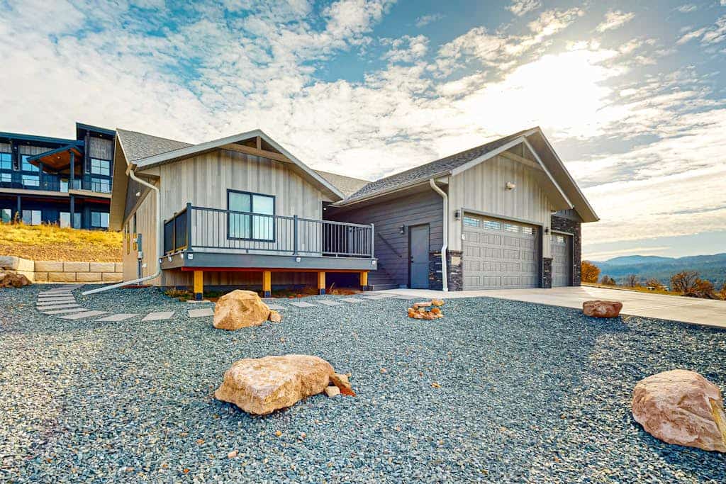 Experience the ultimate Black Hills getaway at this brand new 4 bedroom home nestled between Sturgis and Deadwood. Perfectly situated on a picturesque golf course, this retreat offers mountain views, a private hot tub, and a fun filled arcade room. Whether you are hitting the nearby UTV trails, golfing in your backyard, or visiting Mount Rushmore, our spacious home provides the perfect basecamp. Featuring a chef kitchen, heated garage, and room for trailers, it is the ideal spot for your next group adventure.