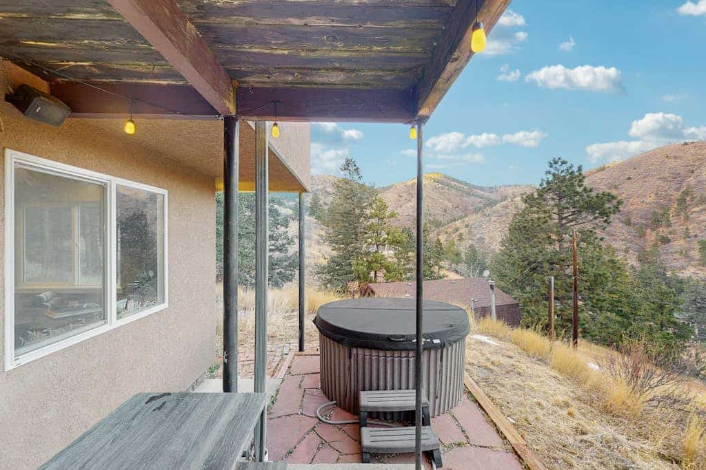 Experience the ultimate mountain getaway at this charming 2-bedroom apartment in Green Mountain Falls. Perfectly positioned with direct access to the Catamount trailhead and routes to Pikes Peak, this dog-friendly retreat features a private hot tub, a fully equipped kitchen, and a scenic patio with mountain views. Ideal for families or groups seeking adventure, you are just moments away from hiking, fishing, and exploring Colorado Springs. Unwind in comfort after a day of outdoor exploration at this peaceful mountain escape.