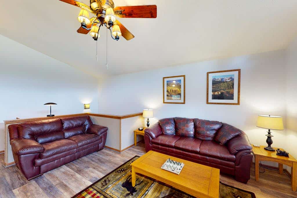 Escape to Horseshoe Haven, a stunning three bedroom mountain retreat in Divide, Colorado. This airy home features vaulted ceilings, a cozy fireplace, and a full kitchen. Relax on the spacious deck with breathtaking mountain views and a grill. Located near Pikes Peak and Mueller State Park, this peaceful home offers easy access to hiking and biking. Whether you seek adventure or a serene getaway, this family friendly retreat is the perfect base for your Colorado Rockies vacation.