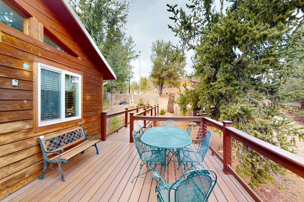 Escape to Horseshoe Haven, a stunning three bedroom mountain retreat in Divide, Colorado. This airy home features vaulted ceilings, a cozy fireplace, and a full kitchen. Relax on the spacious deck with breathtaking mountain views and a grill. Located near Pikes Peak and Mueller State Park, this peaceful home offers easy access to hiking and biking. Whether you seek adventure or a serene getaway, this family friendly retreat is the perfect base for your Colorado Rockies vacation.