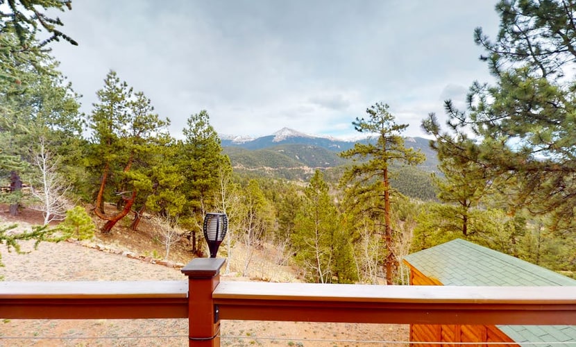 Escape to Horseshoe Haven, a stunning three bedroom mountain retreat in Divide, Colorado. This airy home features vaulted ceilings, a cozy fireplace, and a full kitchen. Relax on the spacious deck with breathtaking mountain views and a grill. Located near Pikes Peak and Mueller State Park, this peaceful home offers easy access to hiking and biking. Whether you seek adventure or a serene getaway, this family friendly retreat is the perfect base for your Colorado Rockies vacation.