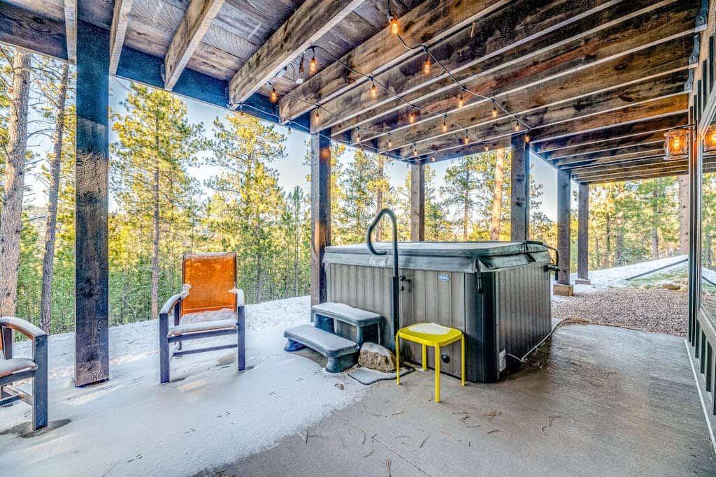 Escape to Pillar Peak Perch, a stunning 5-bedroom luxury lodge nestled in the scenic hills of Sturgis. This modern mountain retreat offers the perfect blend of rustic charm and upscale amenities, including a private hot tub, a spacious game room with a pool table, and a large furnished deck with mountain views. Ideally located for adventure, you are minutes away from world-class hiking, mountain biking, and iconic landmarks like Mount Rushmore and Deadwood. Your ultimate South Dakota getaway awaits.