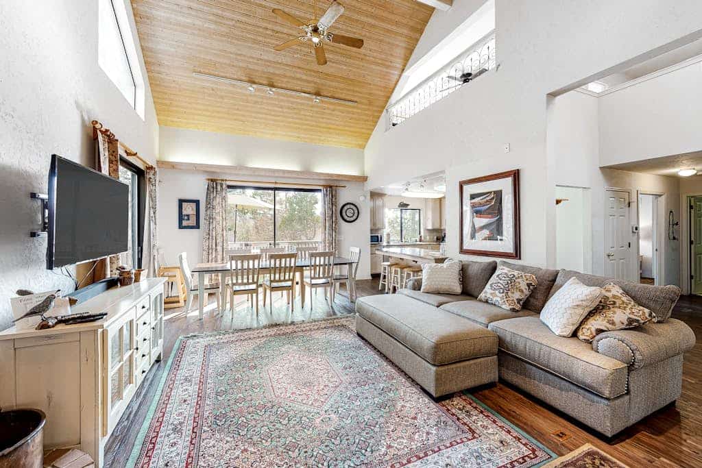 Mountain-view home with large deck, easy lake access & wood stove