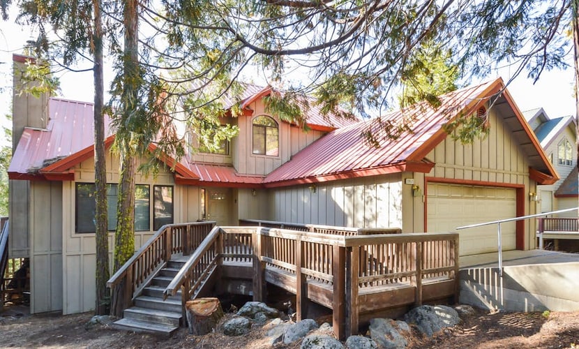 Mountain-view home with large deck, easy lake access & wood stove
