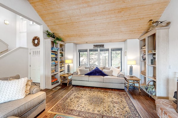 Mountain-view home with large deck, easy lake access & wood stove