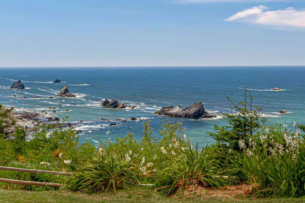 Welcome to The Trinidad Pearl, a private Craftsman home on the Humboldt coast where the ocean is part of everything. Wake to 180-degree ocean views from nearly every room, wander the lovingly kept gardens, cook together in the open chef's kitchen, and soak in the hot tub as the surf breaks below. Read by the fireplace, play a casual game of pickleball, and gather for sunsets by the fire pit. A calm, beautiful place for families and couples to slow down on the Redwood Coast.