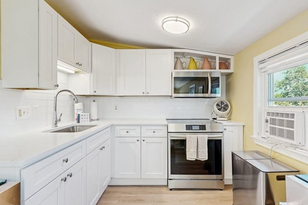 Welcome to White Dory Beach Retreat, a charming one-bedroom, one-and-a-half-bath condominium nestled in Provincetown's sought-after East End. Set within the historic White Dory, this beautifully appointed retreat offers the perfect blend of coastal charm, modern comfort, and an unbeatable location. Spend your days exploring Provincetown's vibrant shops, galleries, and restaurants before returning to your peaceful waterfront escape.
Wake each morning to beautiful bay views from your private deck, where you can sip your coffee as the sun rises over the harbor or unwind with a glass of wine after a day at the beach. Just steps across Commercial Street, the White Dory's private beach invites you to swim, kayak, paddleboard, stroll along the shoreline, or simply soak in Provincetown's spectacular sunsets. Long cherished for its private beach access and tranquil East End setting, the White Dory offers a quintessential Cape Cod experience just moments from the heart of town.
Designed for two guests, the thoughtfully furnished condo features a spacious bedroom with a queen-size bed, one full bath and an additional half bath, a fully equipped kitchen, comfortable living and dining areas, high-speed Wi-Fi, air conditioning, dedicated off-street parking, and beautifully maintained grounds. You'll also enjoy the convenience of being within walking distance of Provincetown's renowned art galleries, cafés, boutique shopping, whale watching excursions, the Pilgrim Monument, and the lively energy of Commercial Street while still enjoying the serenity of the East End.
Whether you're planning a romantic getaway, a relaxing week by the water, or a quintessential Cape Cod escape, White Dory Beach Retreat offers everything you need for an unforgettable stay—private beach access, bay views, modern comforts, and one of Provincetown's most coveted locations.