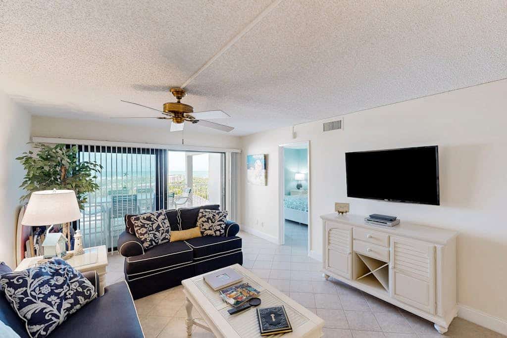 Beachfront condo with ocean views, pool, sundeck, & private balcony