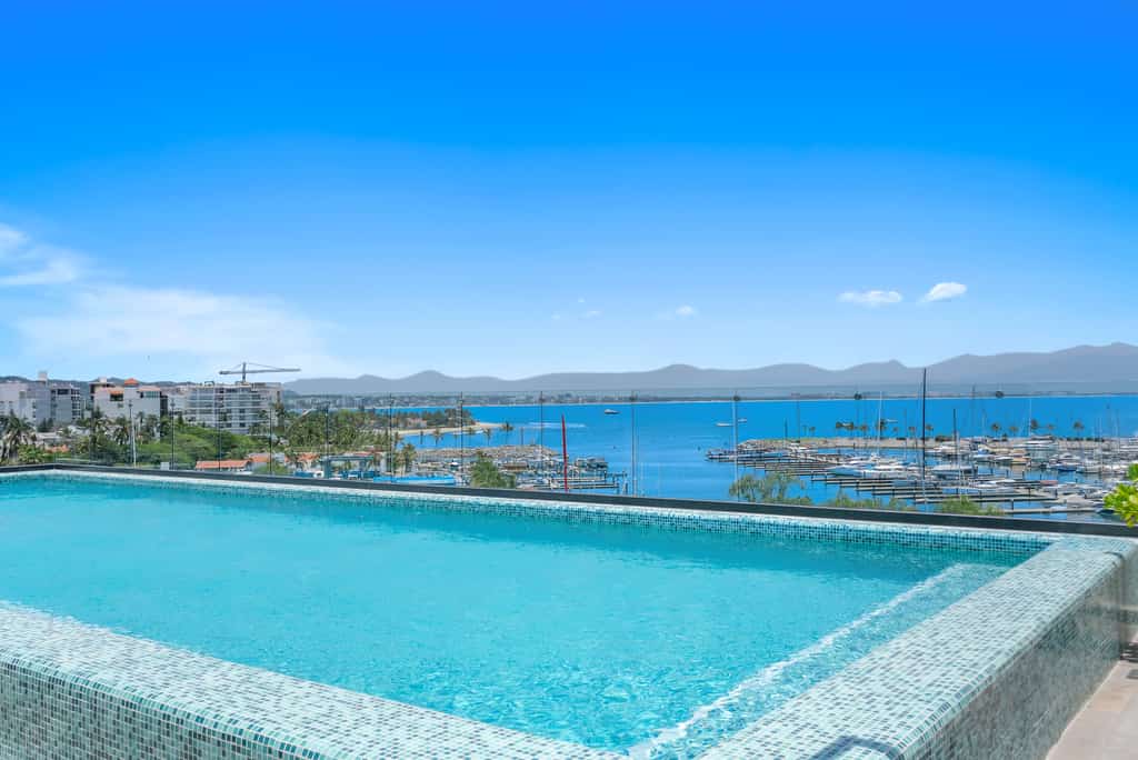 New Listing 2BR condo near the ocean with pool, gym, WiFi, and parking.