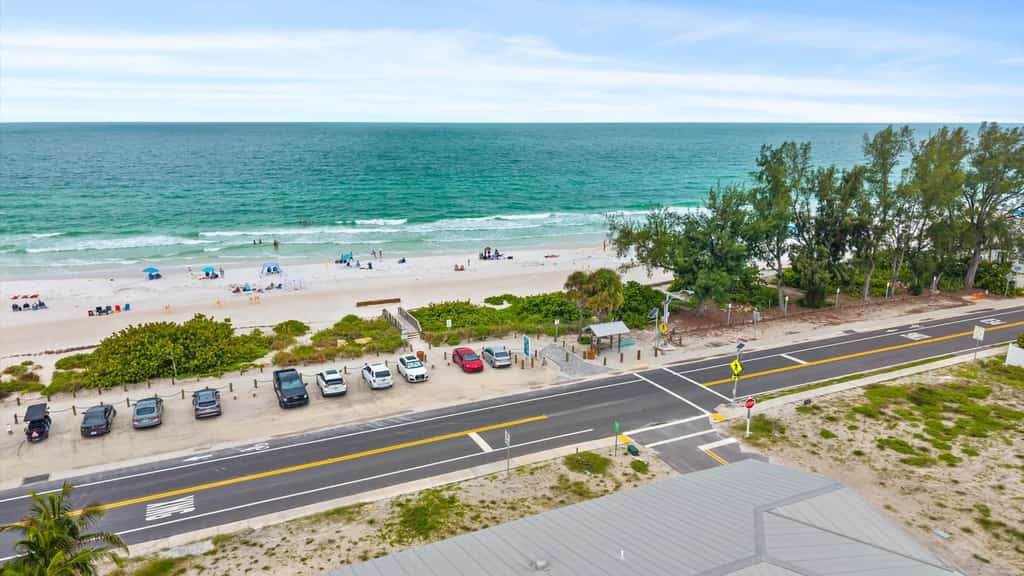 Welcome to The Pearl, a luxurious oceanfront Anna Maria Island vacation home where white-sand beaches and historic charm are just steps from your front door. 

This 6-bedroom home is divided into two apartments with 3-bedrooms and 2.5 baths each, giving your large group plenty of space and privacy. Each floor offers unique and cozy coastal decor, an open-floor plan living room, secondary bedrooms sharing a Jack-and-Jill bath, and a primary suite with a king-sized bed, private oceanview balcony, and spa bath with garden tub. The expansive backyard offers plenty of shaded space for dining and relaxing, along with an outdoor television, heated pool, and putting green. 

Prepare and enjoy family meals in the stocked, ocean-view kitchen and informal dining room, or take advantage of shaded outdoor dining on the patio. Not in the mood to cook? Local favorites are just three blocks away at Historic Bridge Street, the epicenter of South AMI dining and nightlife. 

When its time for the beach, you'll have everything you need, including towels, chairs, and umbrellas.

Key Features & Highlights:
Prime Location: This Anna Maria Island vacation home is located directly across the street from Cortez Beach, putting you just steps away from the ocean.  Historic Bridge Street's dining, shopping and nightlife are just three blocks away.
Light & Airy Living: Open-concept living space designed for gathering with family or friends offers ocean views from the kitchen, dining nook, living room, and primary bedroom.
Beach Ready: Beach gear included so you can sink your toes into the sand from day one!

Book now and see why this expansive oceanview vacation home is truly The Pearl of Anna Maria Island. 