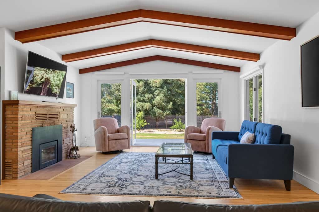 Named for Sebastopol's hometown apple, The Gravenstein is a newly renovated single-story retreat tucked into a serene redwood grove with its own small orchard — apricot, peach, cherry, plum, and apple trees you're welcome to sample in season. Soak in the brand-new 7-foot hot tub, roast s'mores at the stone fire pit ringed by Adirondack chairs, then rack a game on the new pool table at the game-room bar. Sleeps 6 in two bedrooms plus a den, about 10 minutes from The Barlow's tasting rooms.