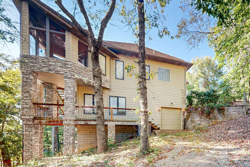 Elegant lake house with gourmet kitchen, game room, scenic views & lake frontage