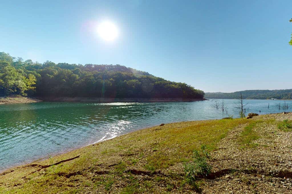 Elegant lake house with gourmet kitchen, game room, scenic views & lake frontage