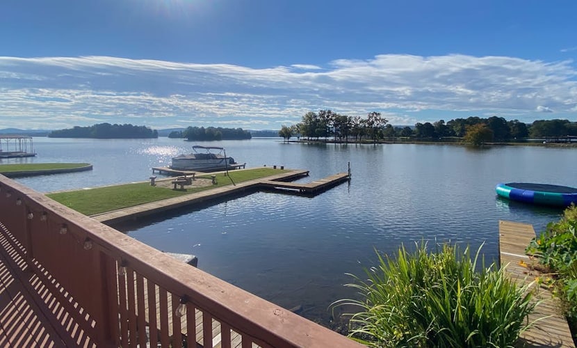 Serene lakefront condo with stunning views, private boat slip, and spacious deck