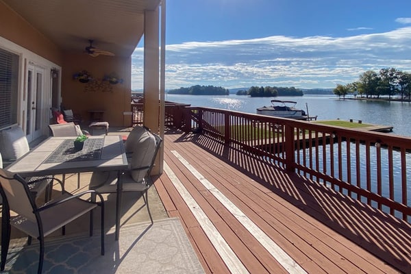 Serene lakefront condo with stunning views, private boat slip, and spacious deck