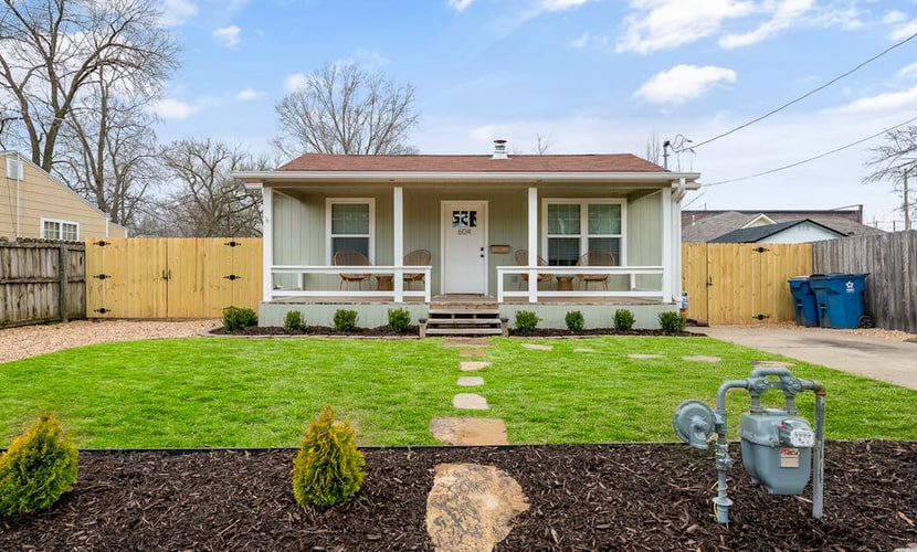Dog-friendly home with a firepit, yard, washer/dryer, central AC & game room
