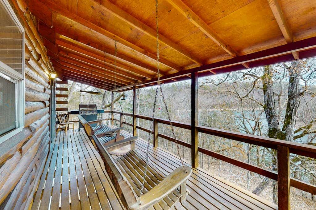 Lakefront dog-friendly log cabin with private boat access, firepit, & grill