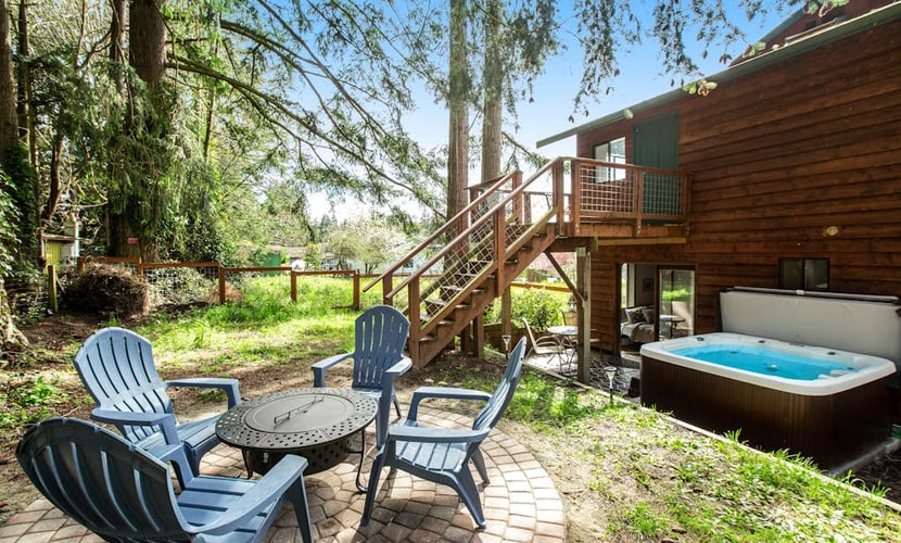 Log-style mountain and bay-view retreat with hot tub, game rooms, & balcony