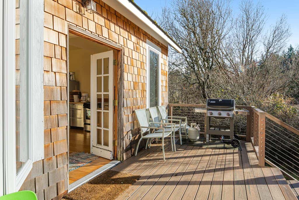 Classic farmhouse-style home with front porch & amazing sunset views - walk to town