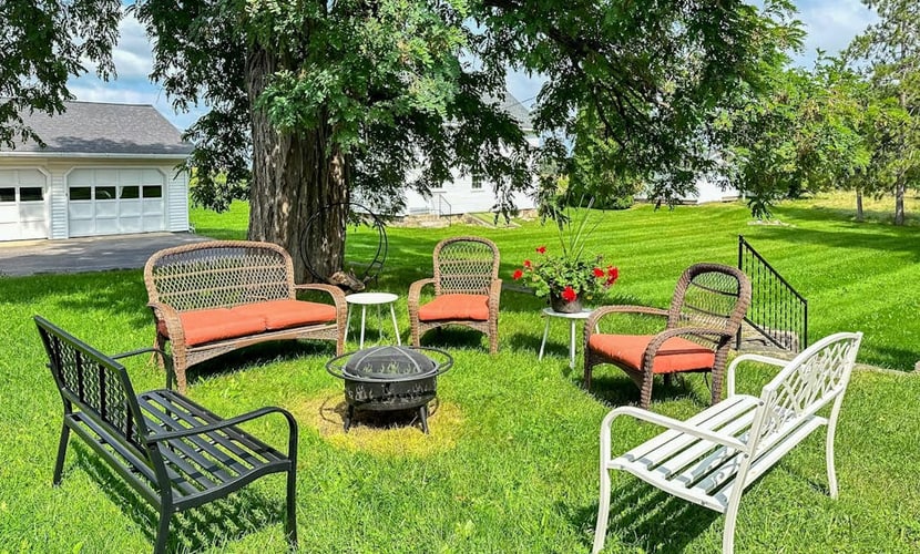 Classic country retreat with a game room, bar, expansive outdoor space, & grill
