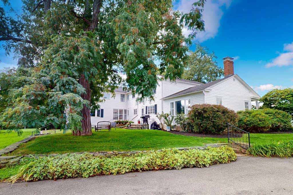 Classic country retreat with a game room, bar, expansive outdoor space, & grill