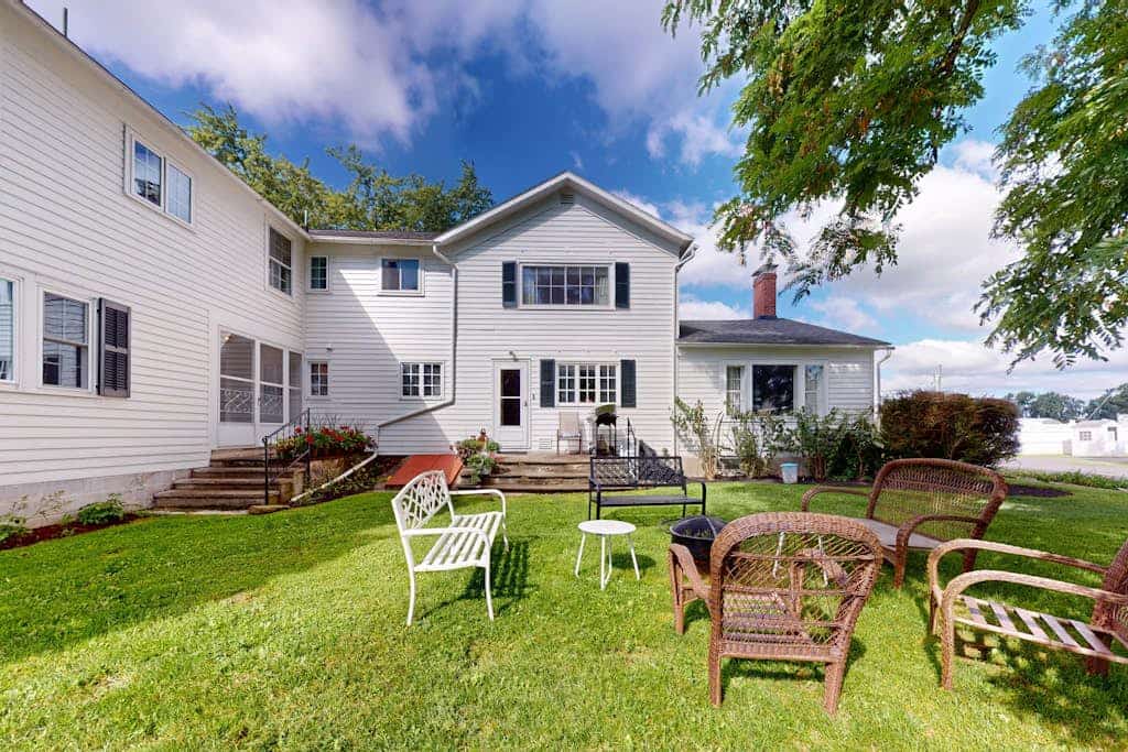 Classic country retreat with a game room, bar, expansive outdoor space, & grill