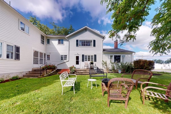 Classic country retreat with a game room, bar, expansive outdoor space, & grill