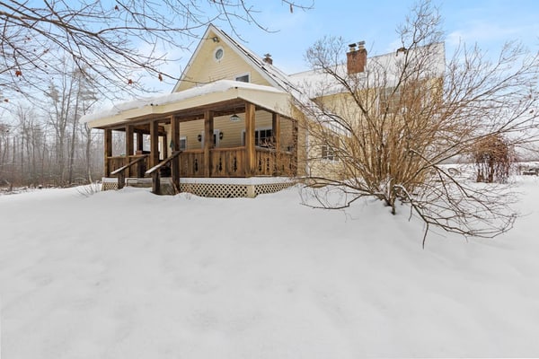 1970s acreage surrounded by trees with deck, grill, & internet