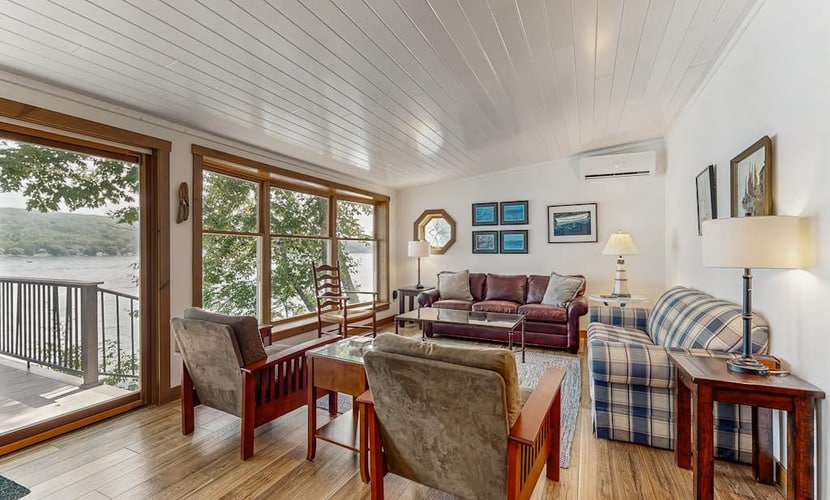 Delightful lakefront house with furnished deck, balcony, and private dock