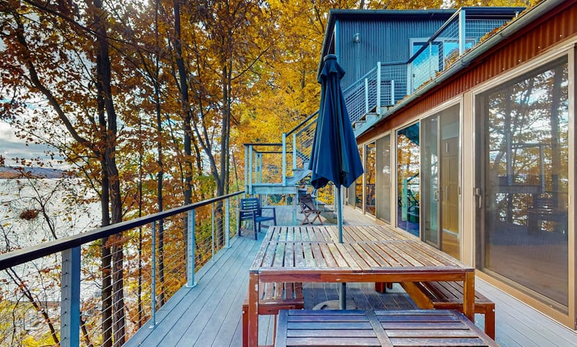 Lakefront contemporary gem with decks, lake views & pebble beach