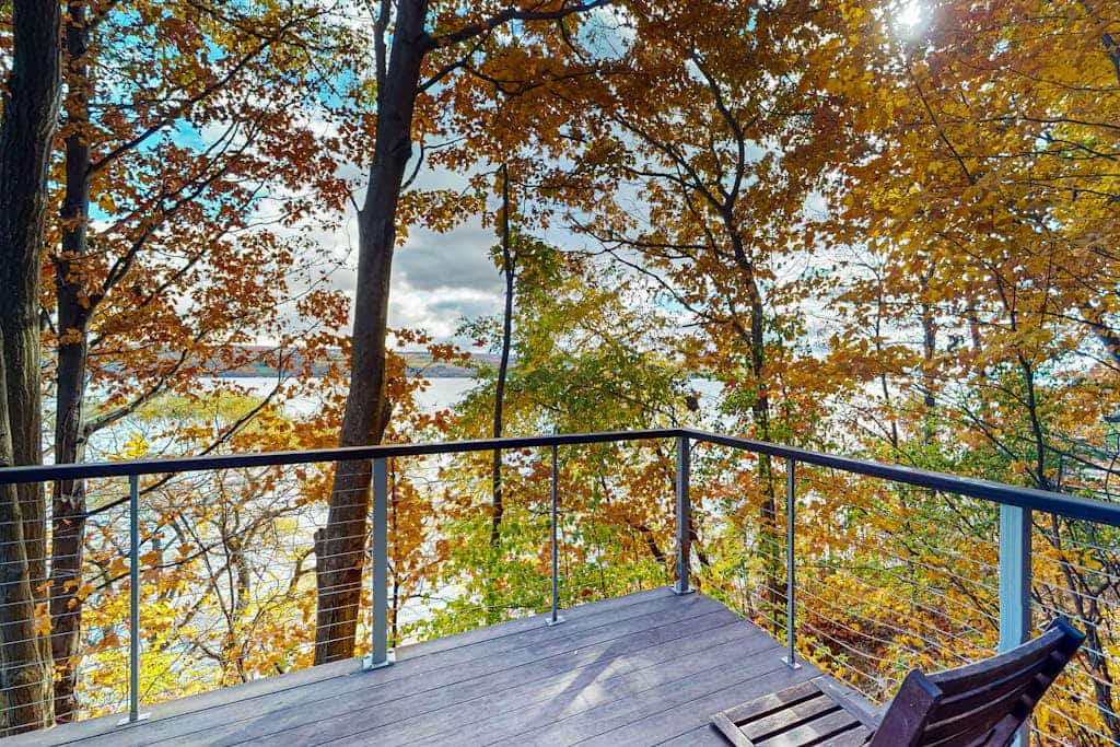 Lakefront contemporary gem with decks, lake views & pebble beach