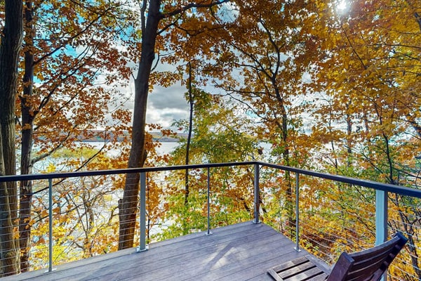 Lakefront contemporary gem with decks, lake views & pebble beach