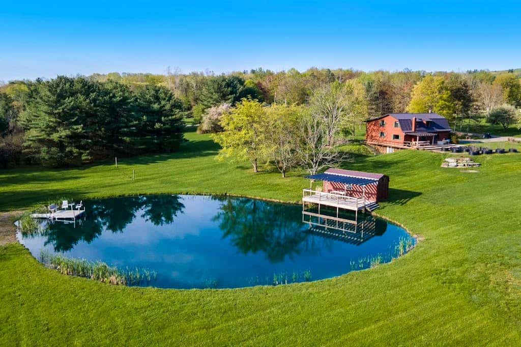 Relaxing dog-friendly water-view cabin with firepit, deck, grill, & full kitchen