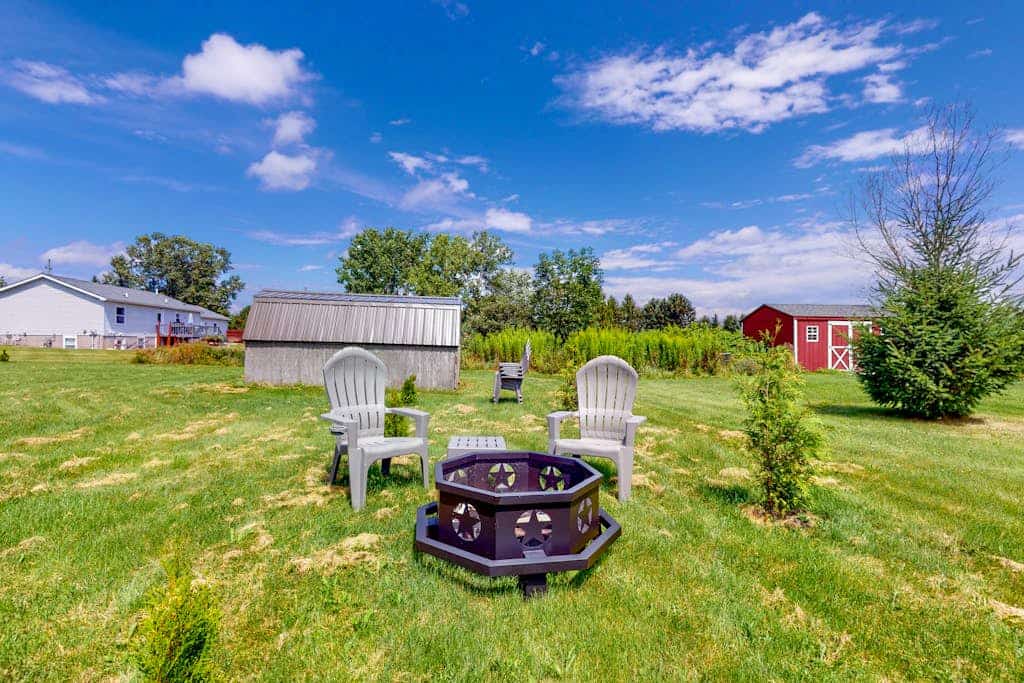 Relaxing two-story home with a deck, firepit, game room, & washer/dryer
