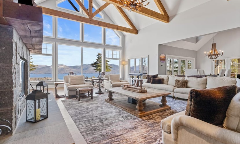 Panoramic lake view acreage with game room, sauna & fireplace