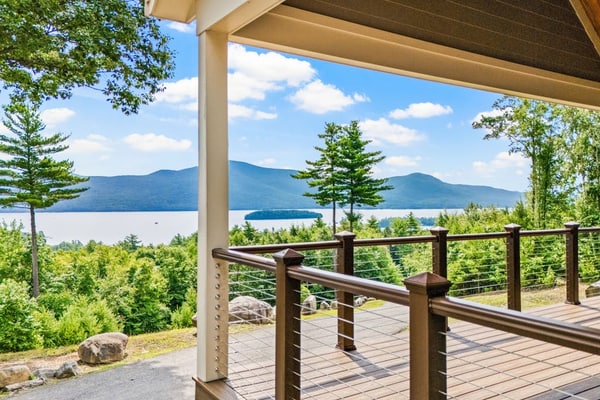 Panoramic lake view acreage with game room, sauna & fireplace