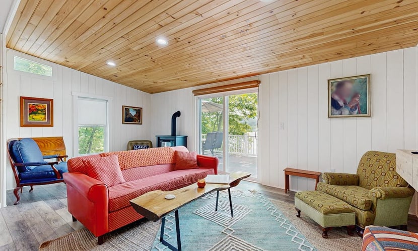 Lake-view home with private water access, dock, 2 kayaks, deck, & fireplaces