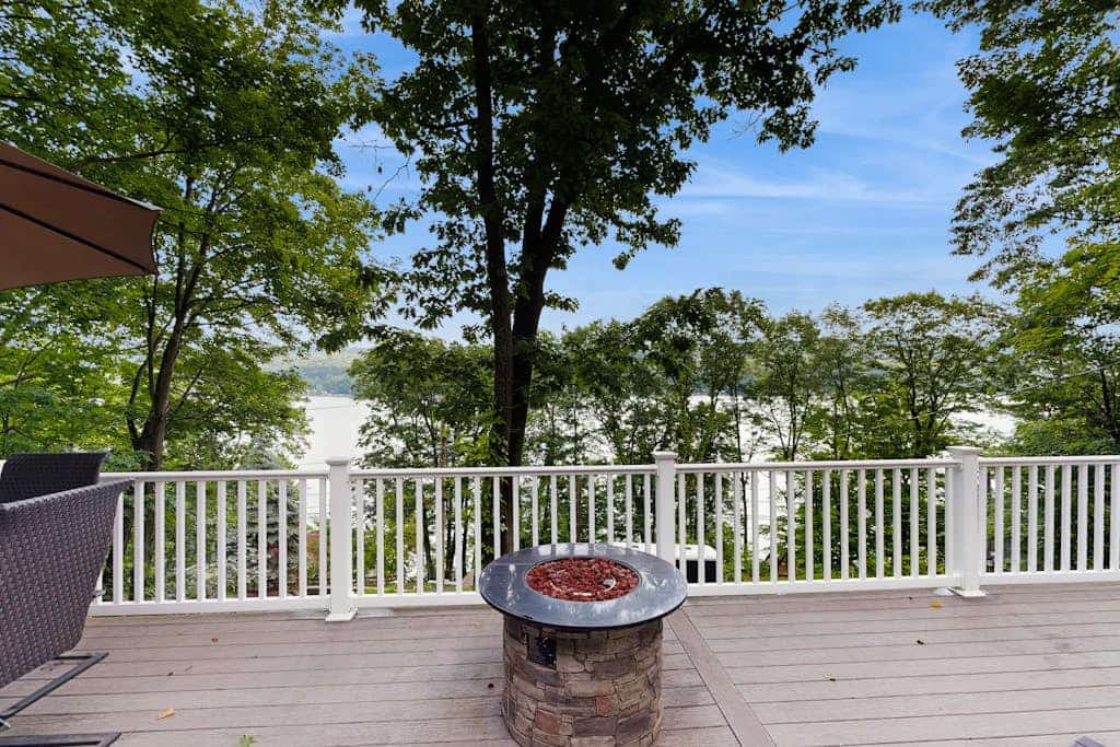 Lake-view home with private water access, dock, 2 kayaks, deck, & fireplaces