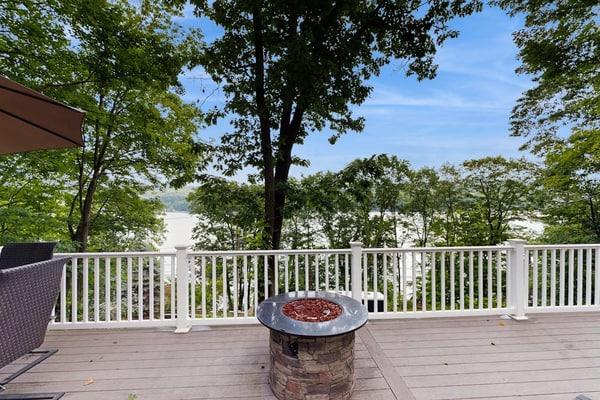 Lake-view home with private water access, dock, 2 kayaks, deck, & fireplaces