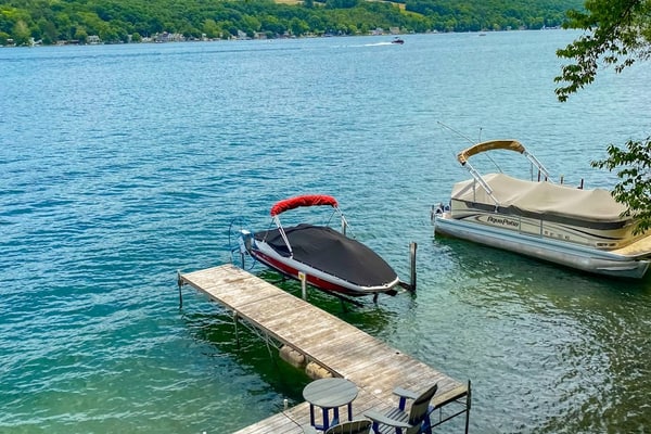 Lake-view home with private water access, dock, 2 kayaks, deck, & fireplaces