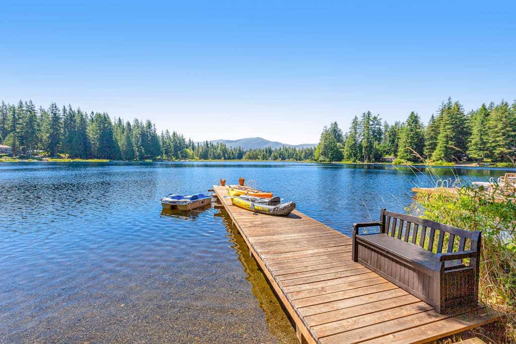 Two lakefront cabins with two docks, kayaks, 100' of waterfront, deck, & firepit