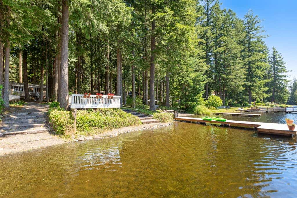 Two lakefront cabins with two docks, kayaks, 100' of waterfront, deck, & firepit