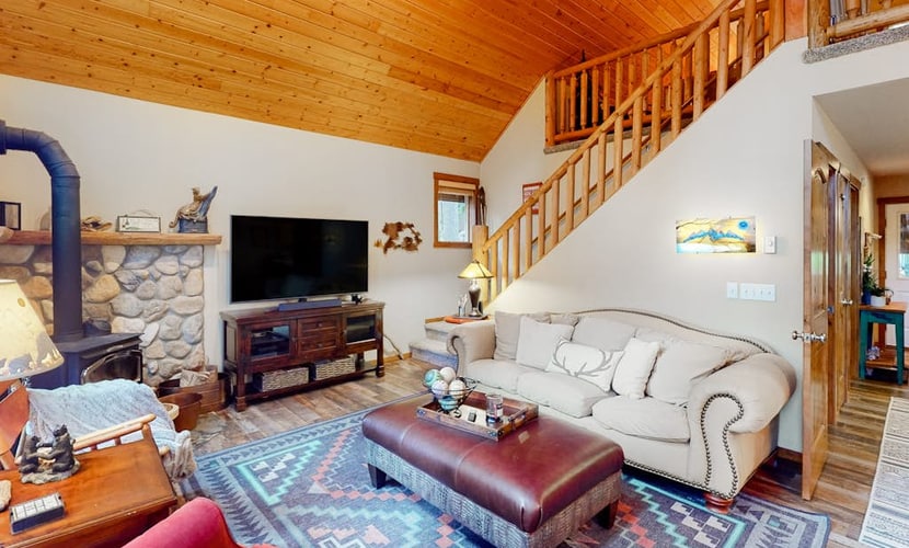 Three-story, dog-friendly home with a private hot tub, firepit, & wood stove
