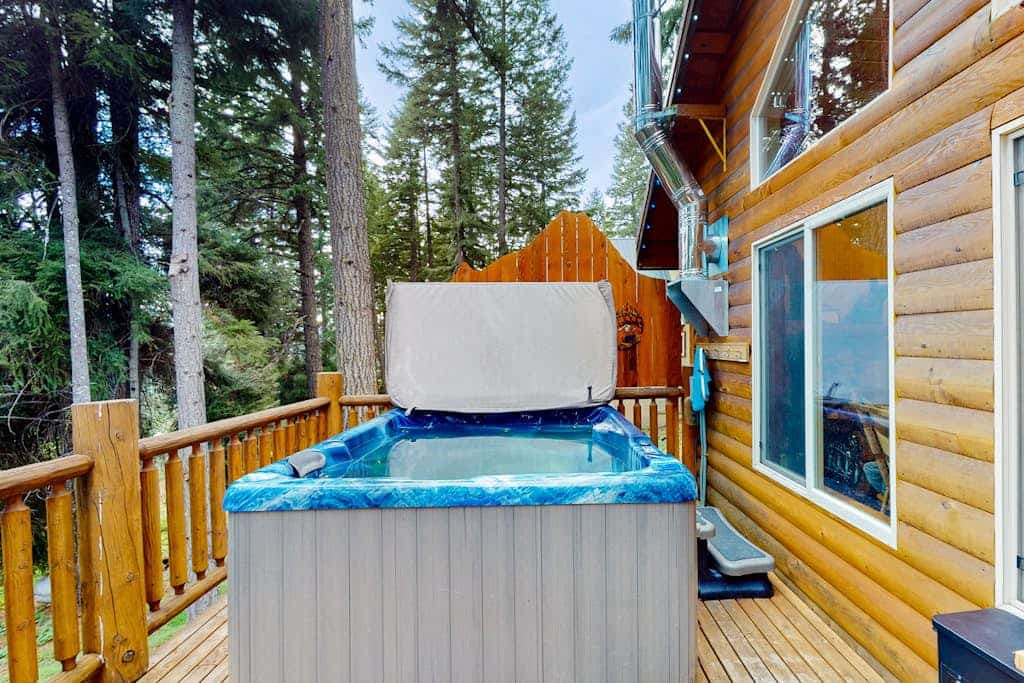 Three-story, dog-friendly home with a private hot tub, firepit, & wood stove