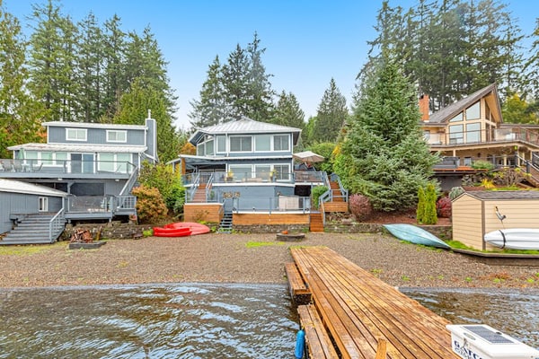 Sprawling lakefront property with kayaks, large deck, game table, & fireplace