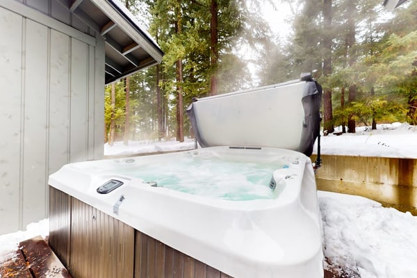 Gorgeous tree-lined home with hot tub, fireplace, grill, mountain views, & AC